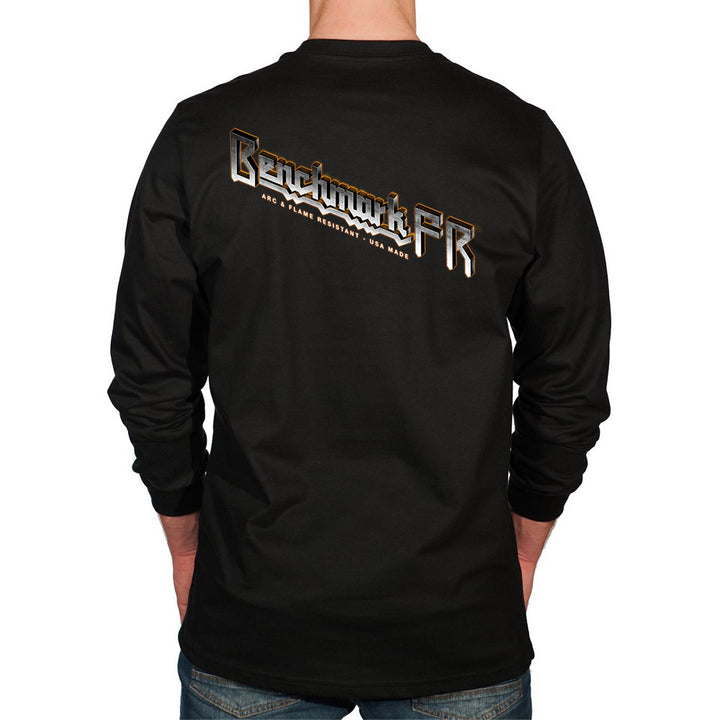 Black long-sleeve shirt with 'Benchmark FR' logo on the back, worn by a person.