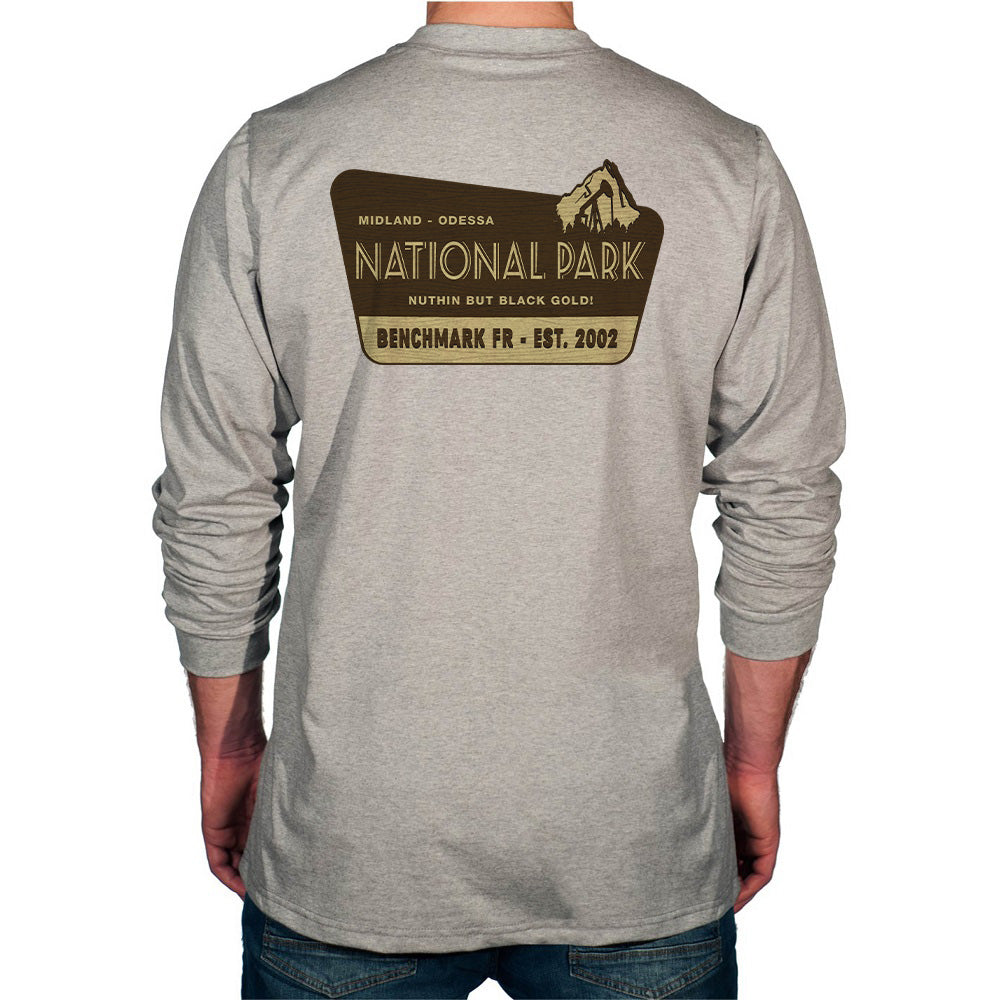 Gray long-sleeve shirt with a National Park logo on the back, worn by a person.